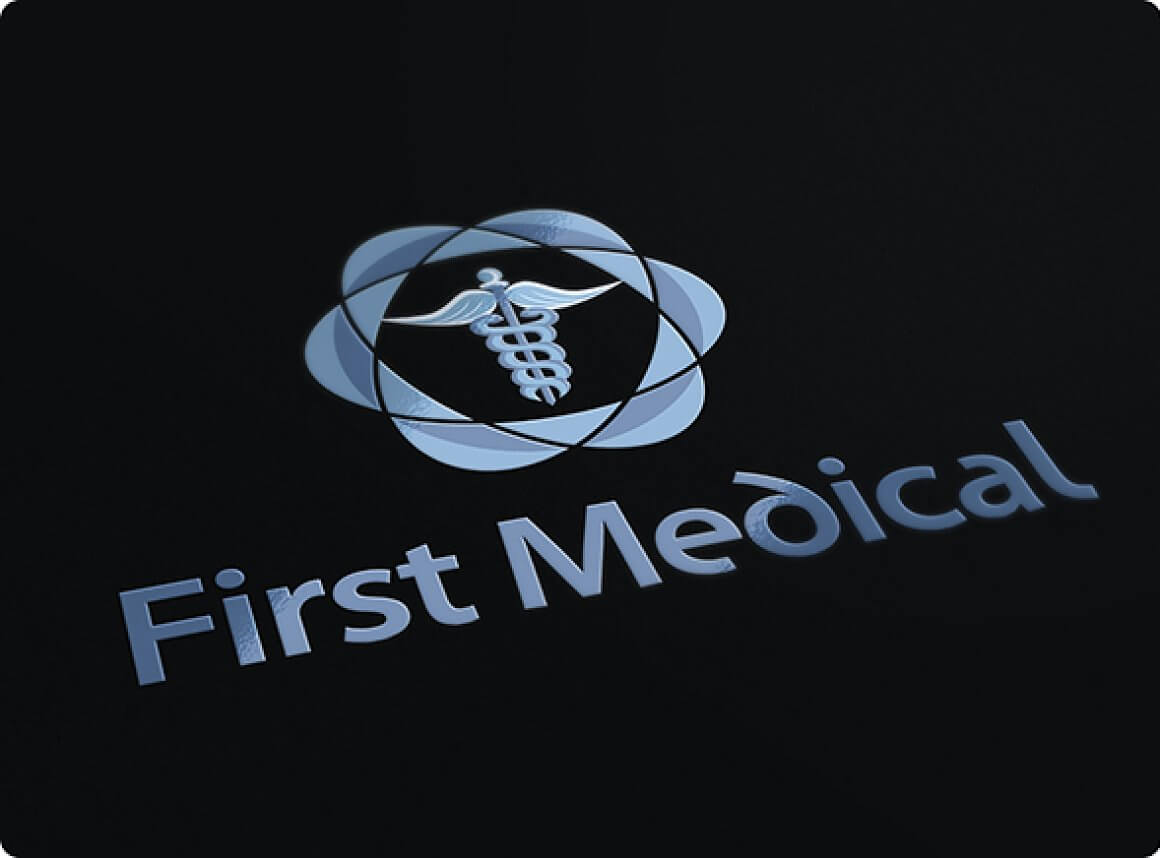 Medical logo close-up at an angle on a black background.
