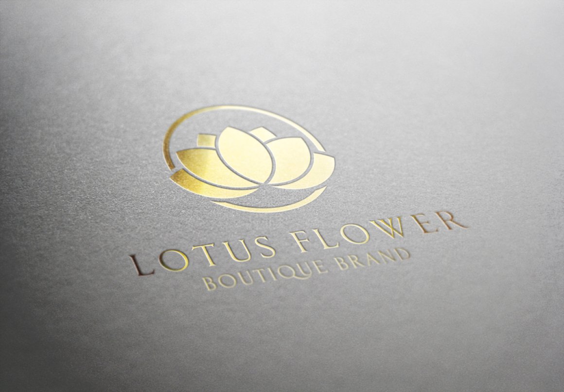 Golden lotus flower logo on gray textured paper.