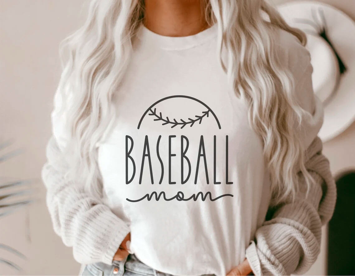 Baseball logo on a white T-shirt on the girl's chest.