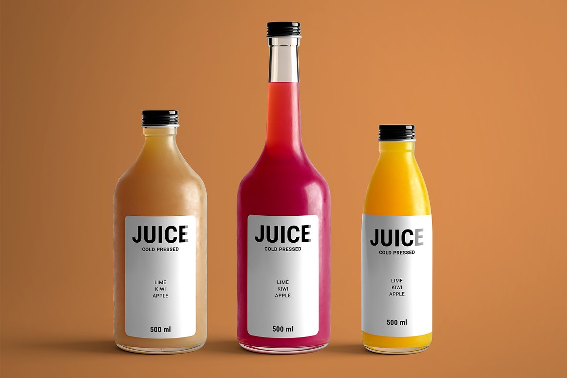 Three bottles with juice of different shapes and colors.