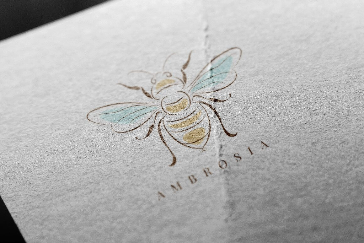 Ambrosia logo on white and gray textured material.