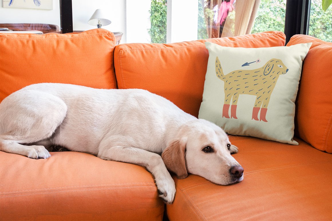 The dog is sad and lies on the orange sofa.