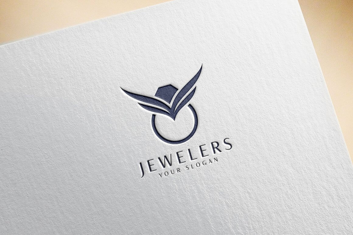 Large blue logo for jewelry rings on textured gray paper.