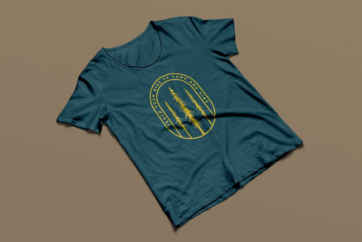 Yellow logo with vintage trees on a green t-shirt.