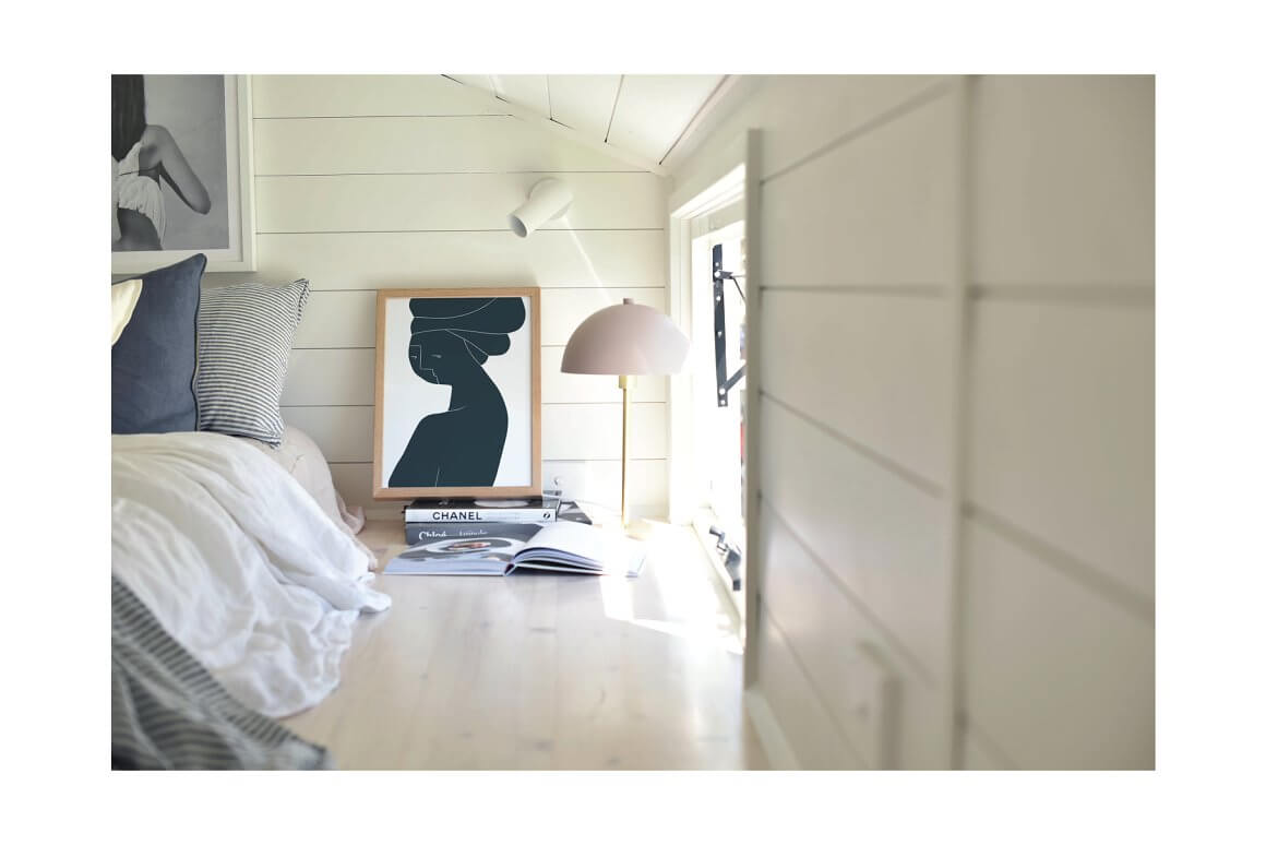 Roofed bedroom with black and white abstraction of a girl's figure.