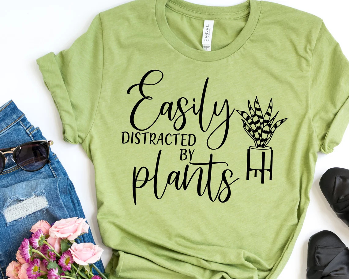 Print on a green t-shirt on the topic of plant growing.
