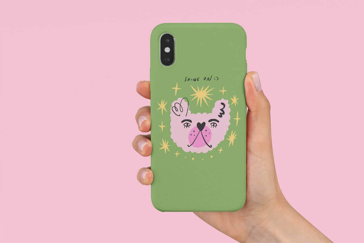 The face of a dog is painted on the green case of the phone.