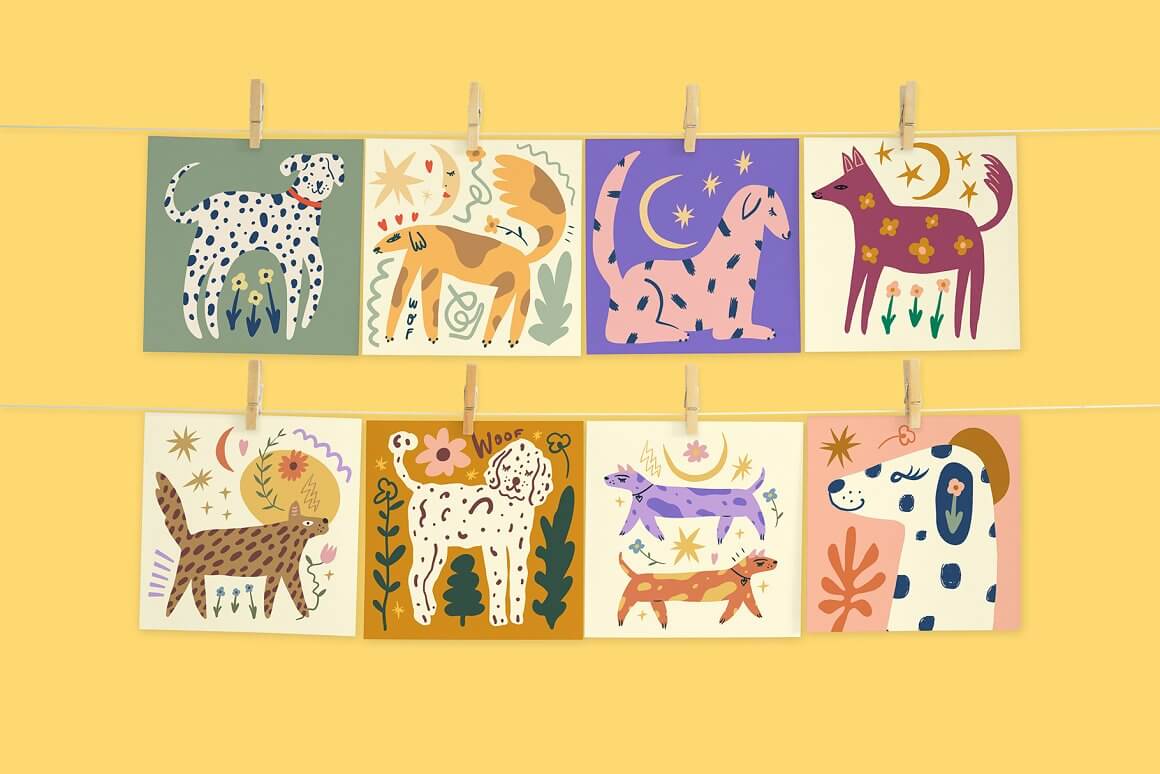 Cards with funny dogs hang on a thread and are attached with a clothespin.