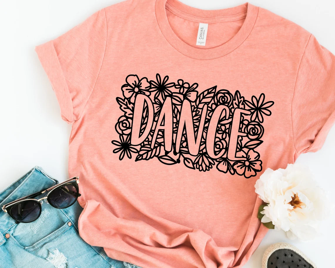 Orange t-shirt with the inscription dancing on a floral background.