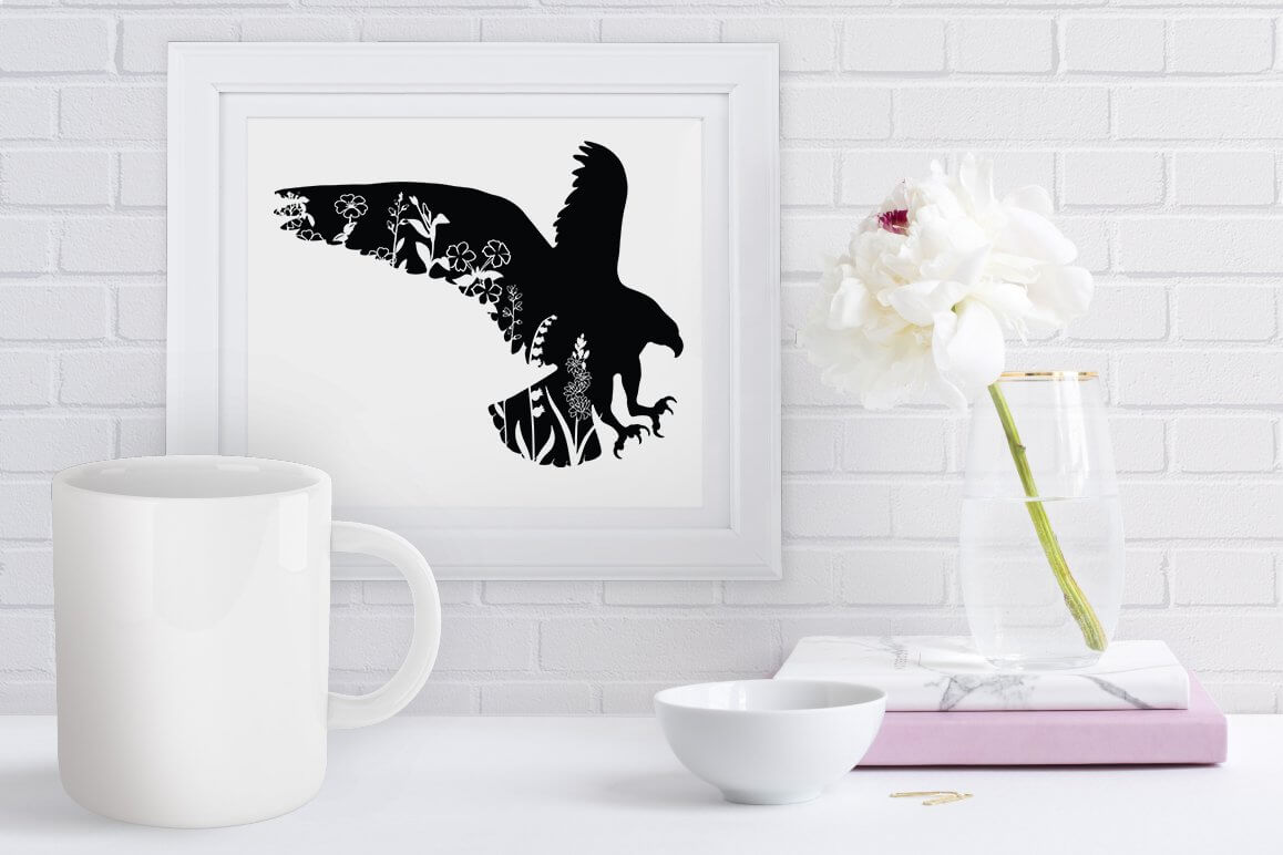A floral eagle is drawn on a white picture.