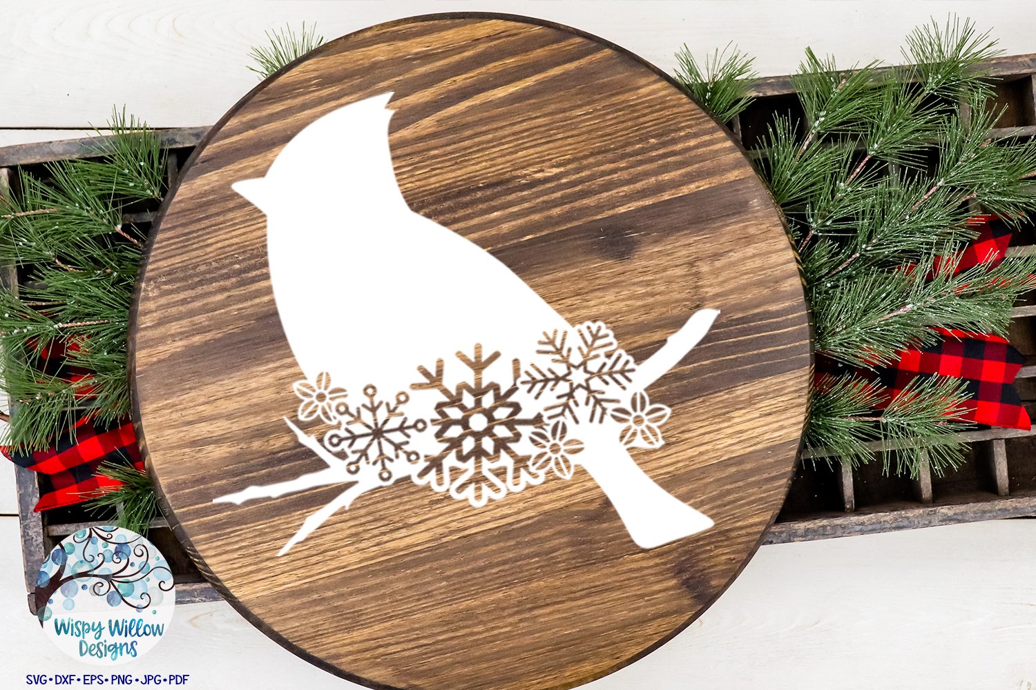 A wooden circle with a white cardinal print.