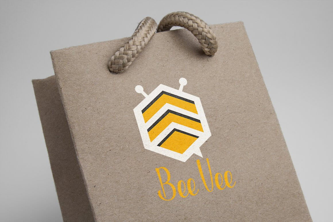 Beige cardboard bag with geometric bee logo.