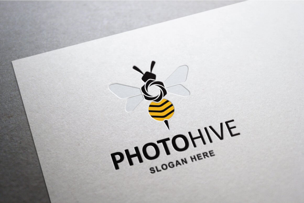 Colored bee logo on a white sheet of paper.