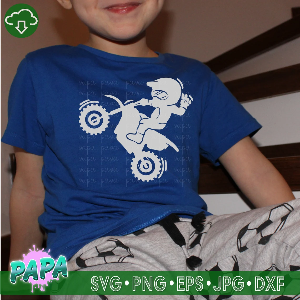 Biker print of a children's motorcyclist on a blue T-shirt.