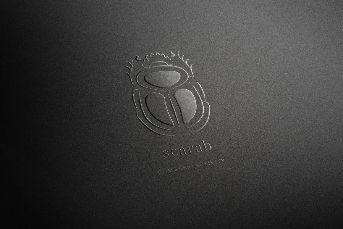 Logo with a design image of a black embossed scarab on a black matte background.