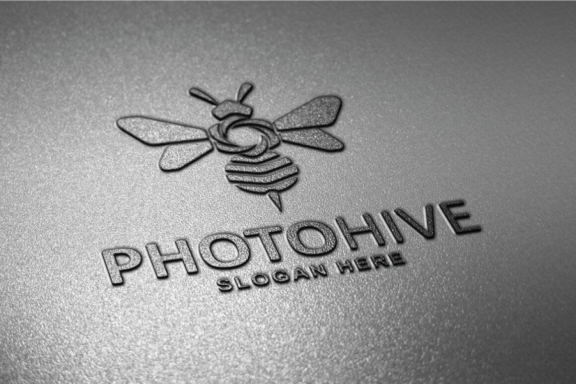 Logo of a gray embossed bee on a gray textured background.