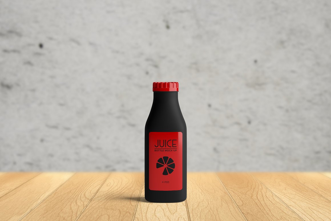 A black bottle with a red cap.