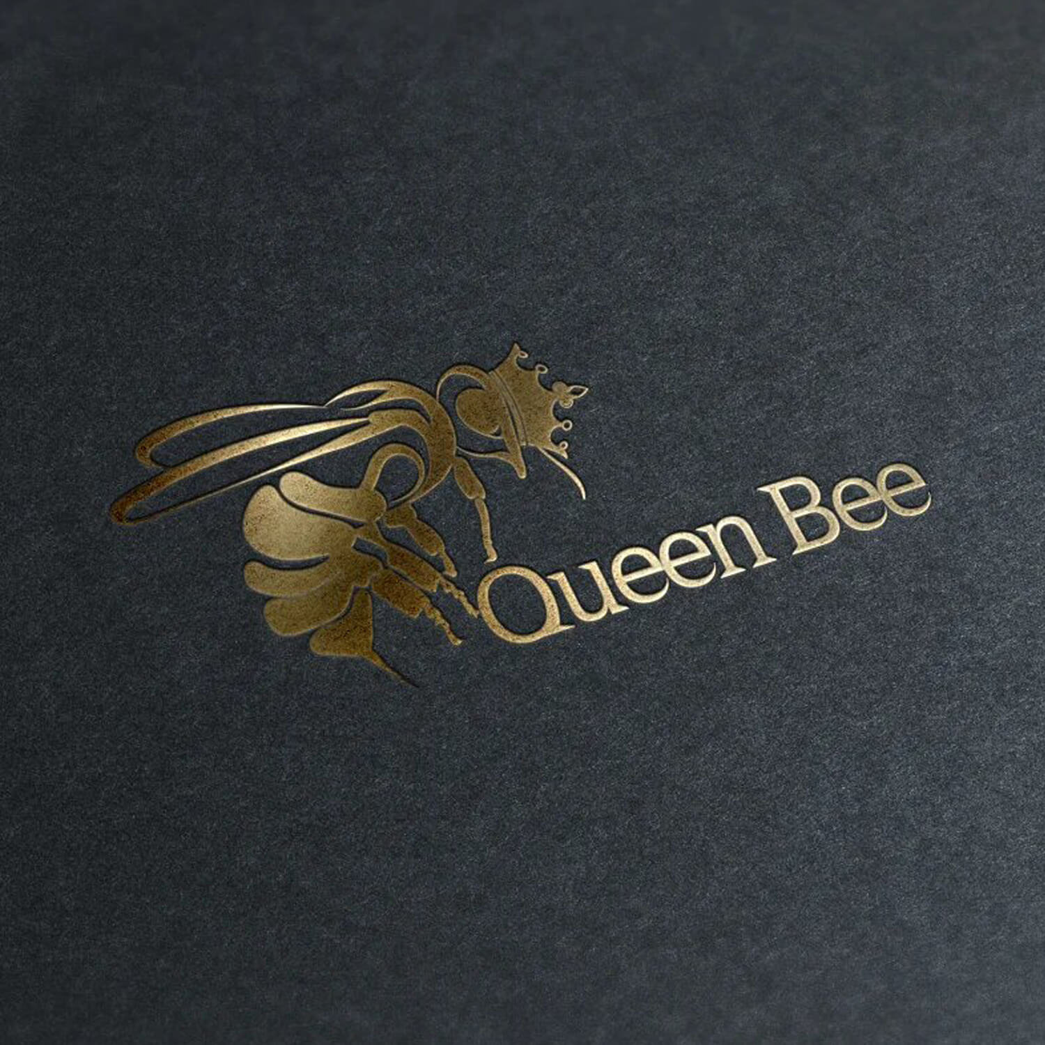 Golden bee and the inscription in gold color "queen bee" on a gray velvet background.