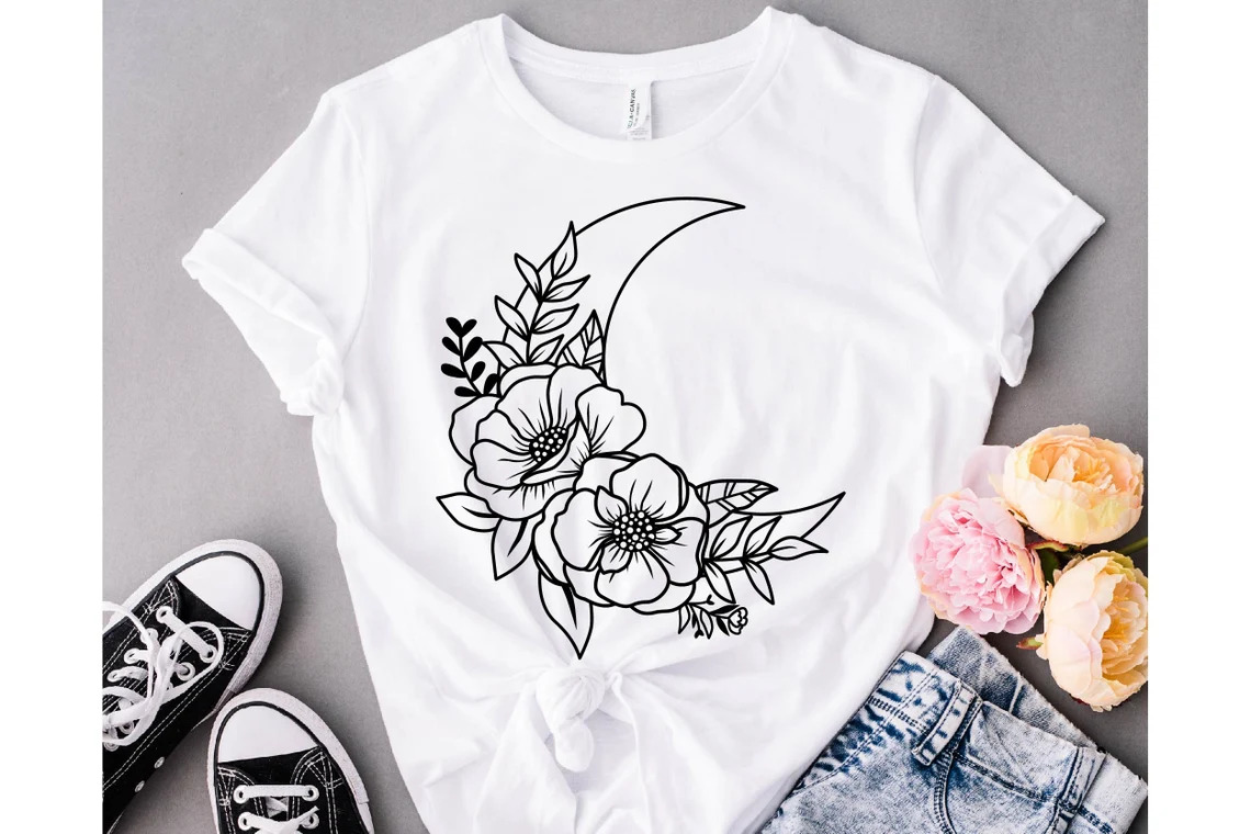 Half moon on a t-shirt with a flower.