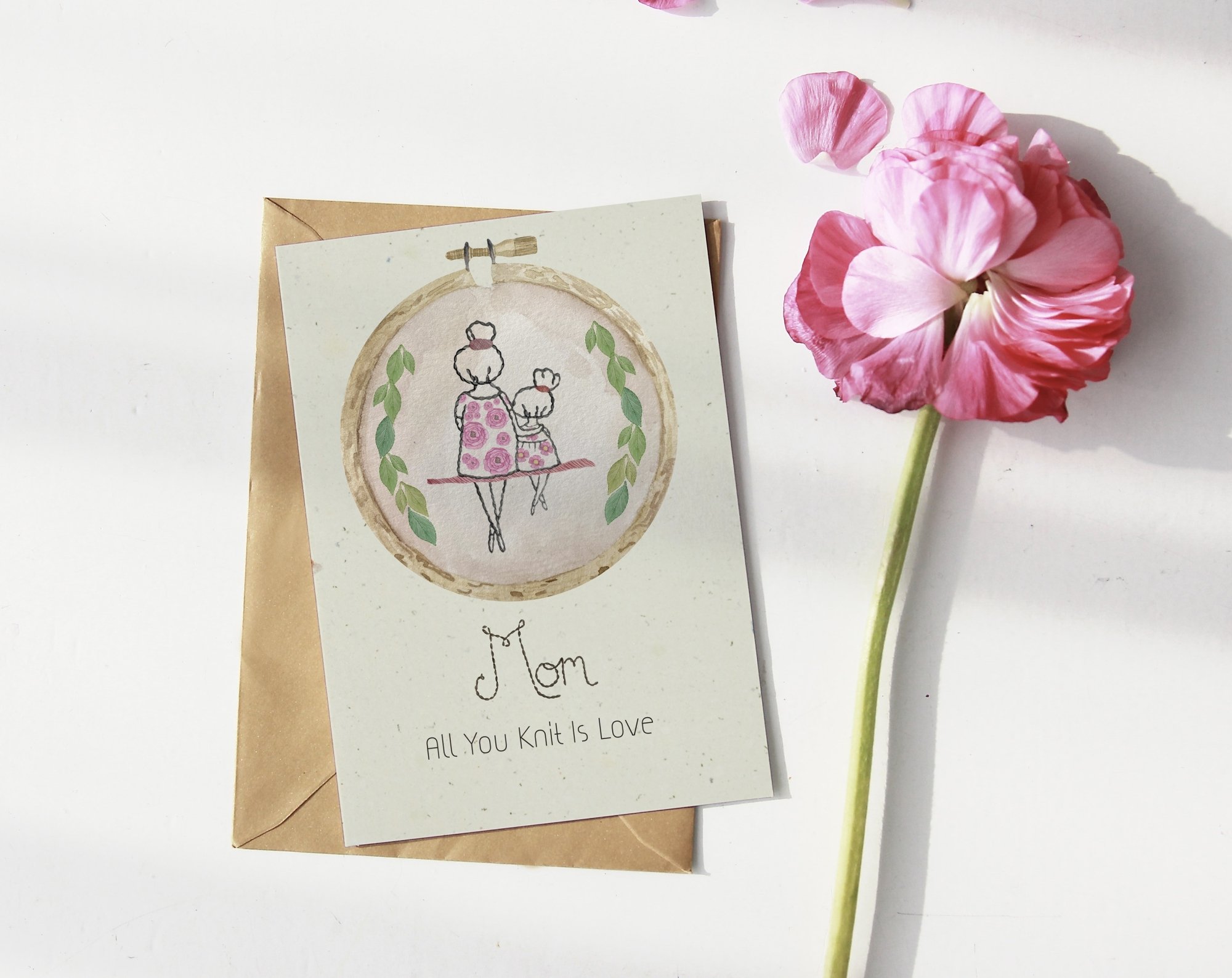 Card print with mother and child and flowers.