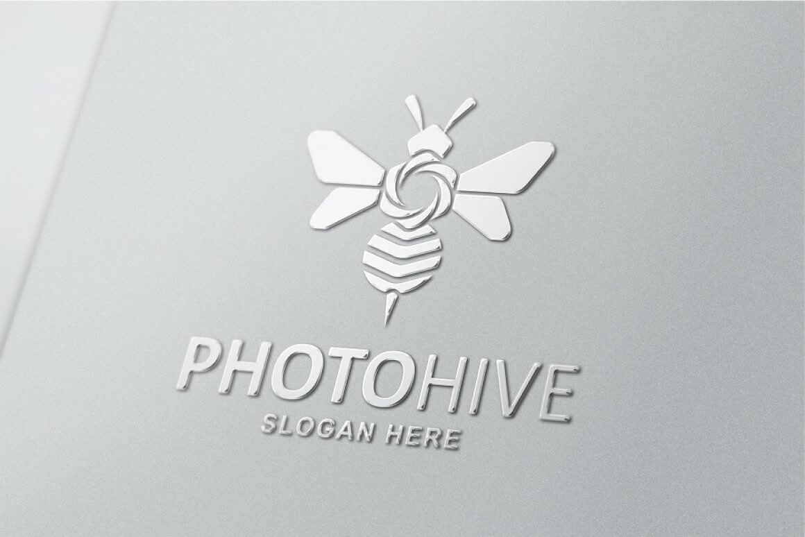 Silver chrome bee logo on a gray background.