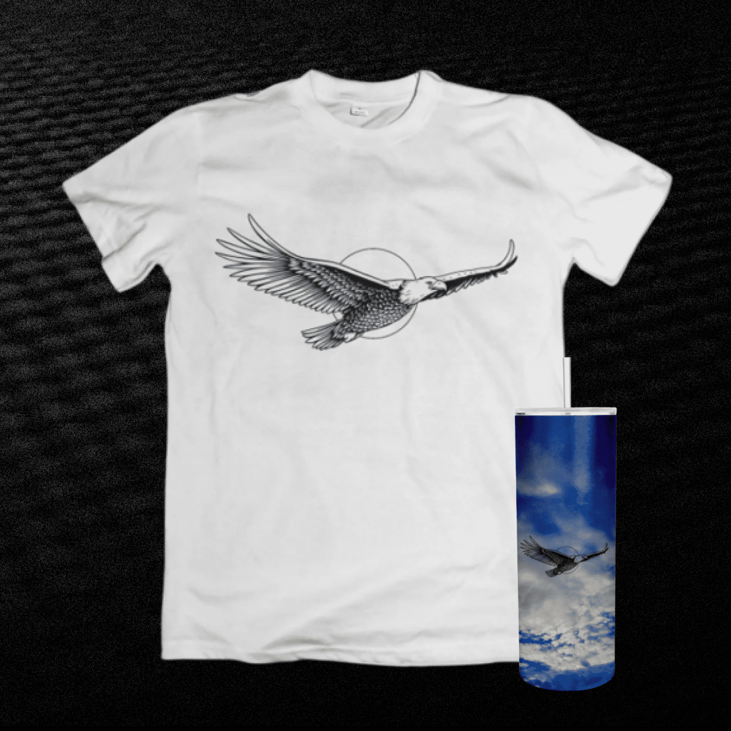 White t - shirt with a bird on it next to a blue can.
