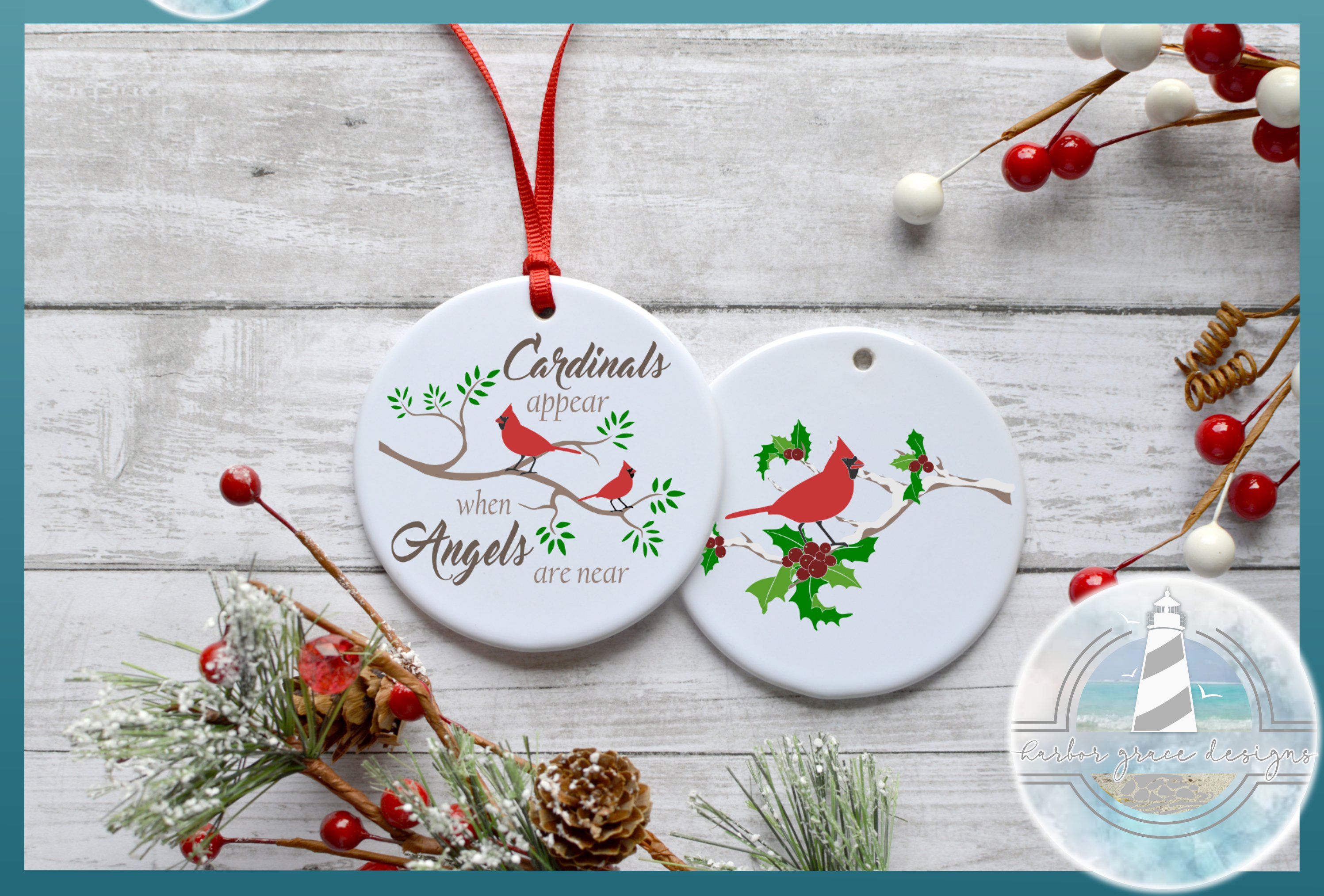 Two ceramic ornaments with a red bird on them.
