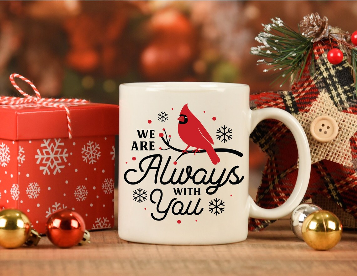 White coffee mug with a cardinal on it.