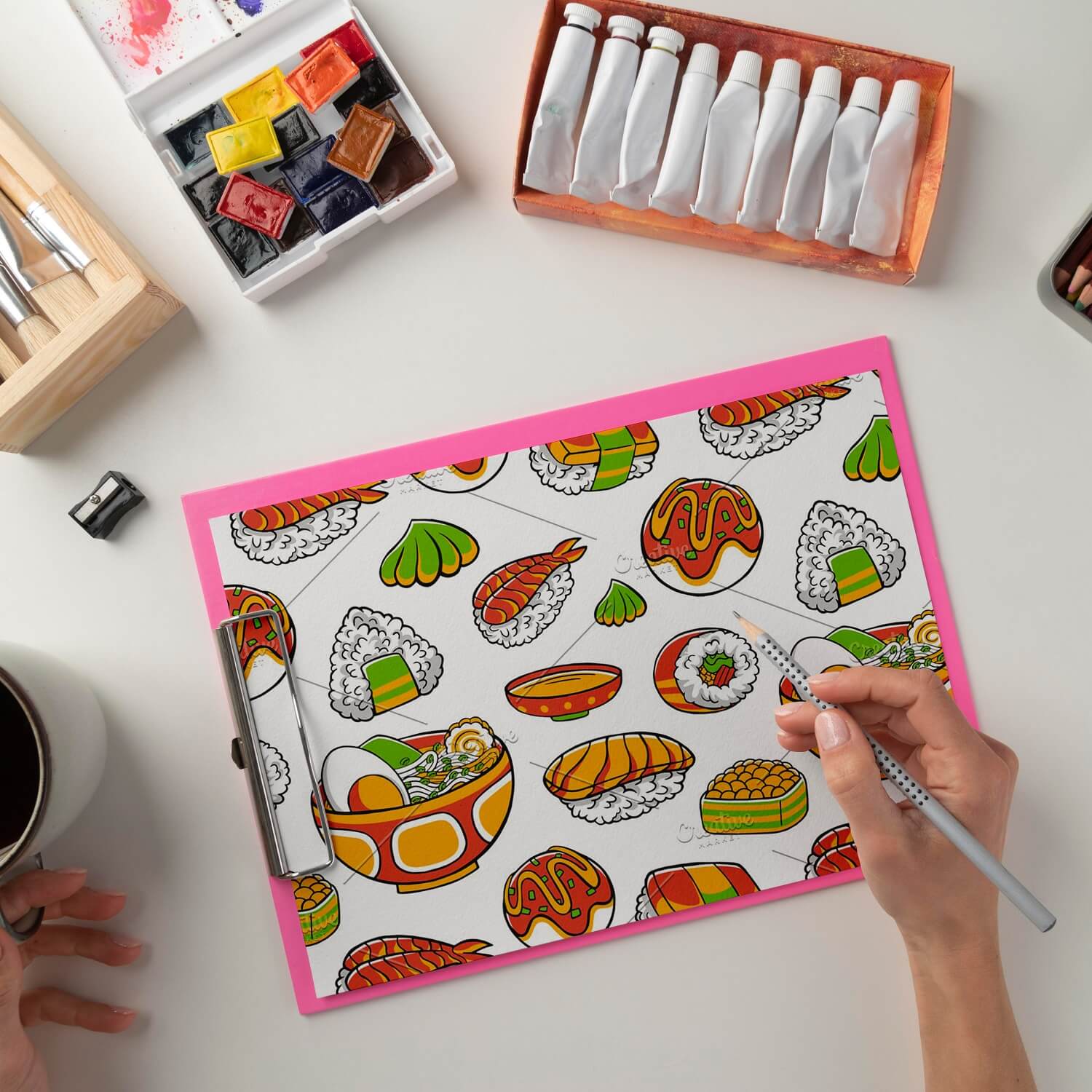 A girl draws a picture of Japanese cuisine.