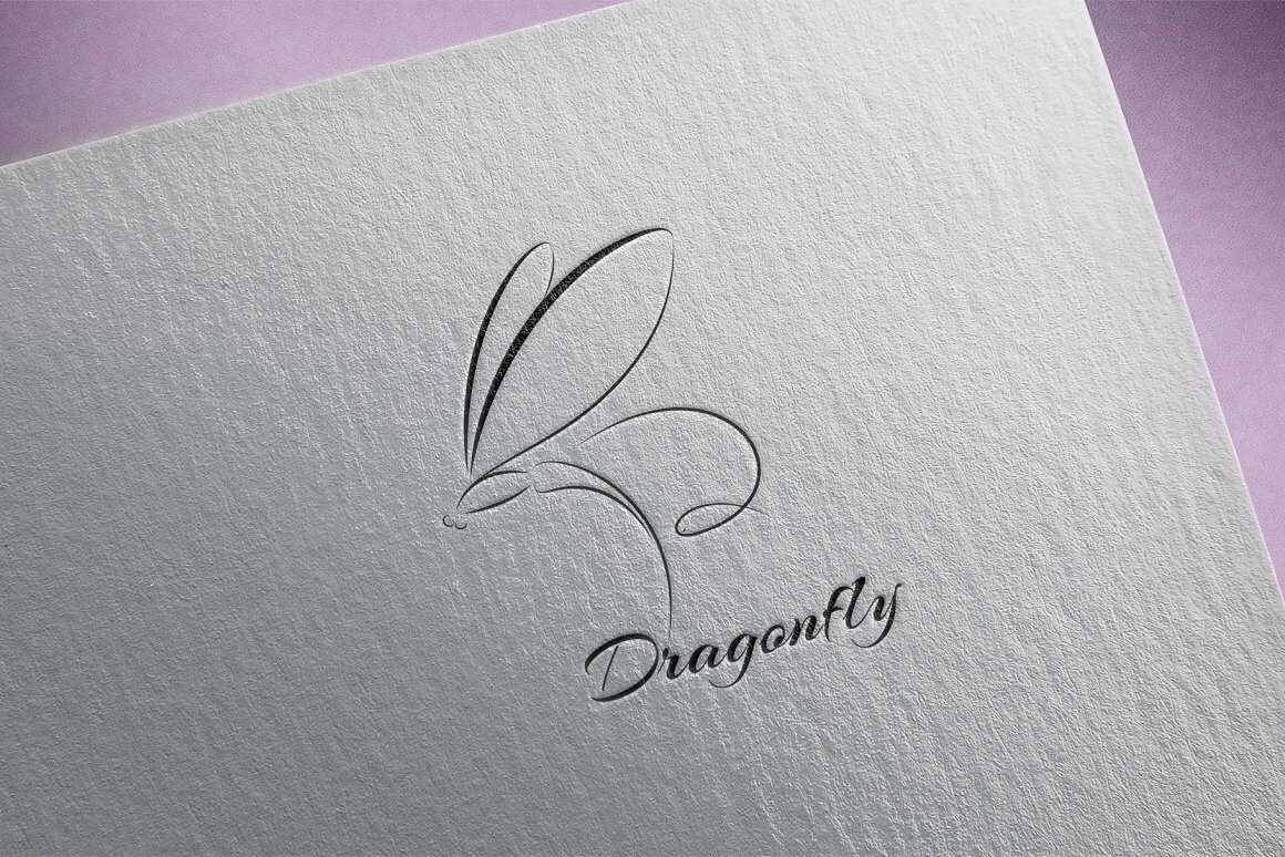 Black Dragonfly logo on gray paper against a lilac background.