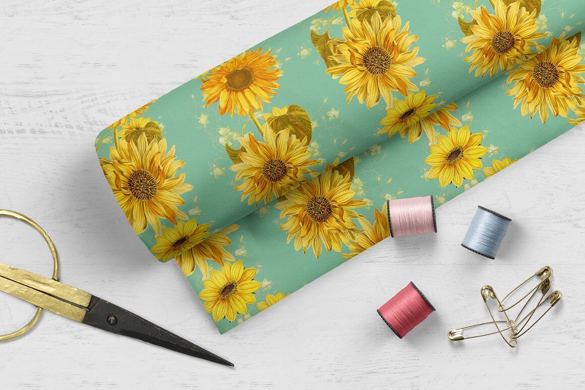 Light green fabric with yellow sunflowers.