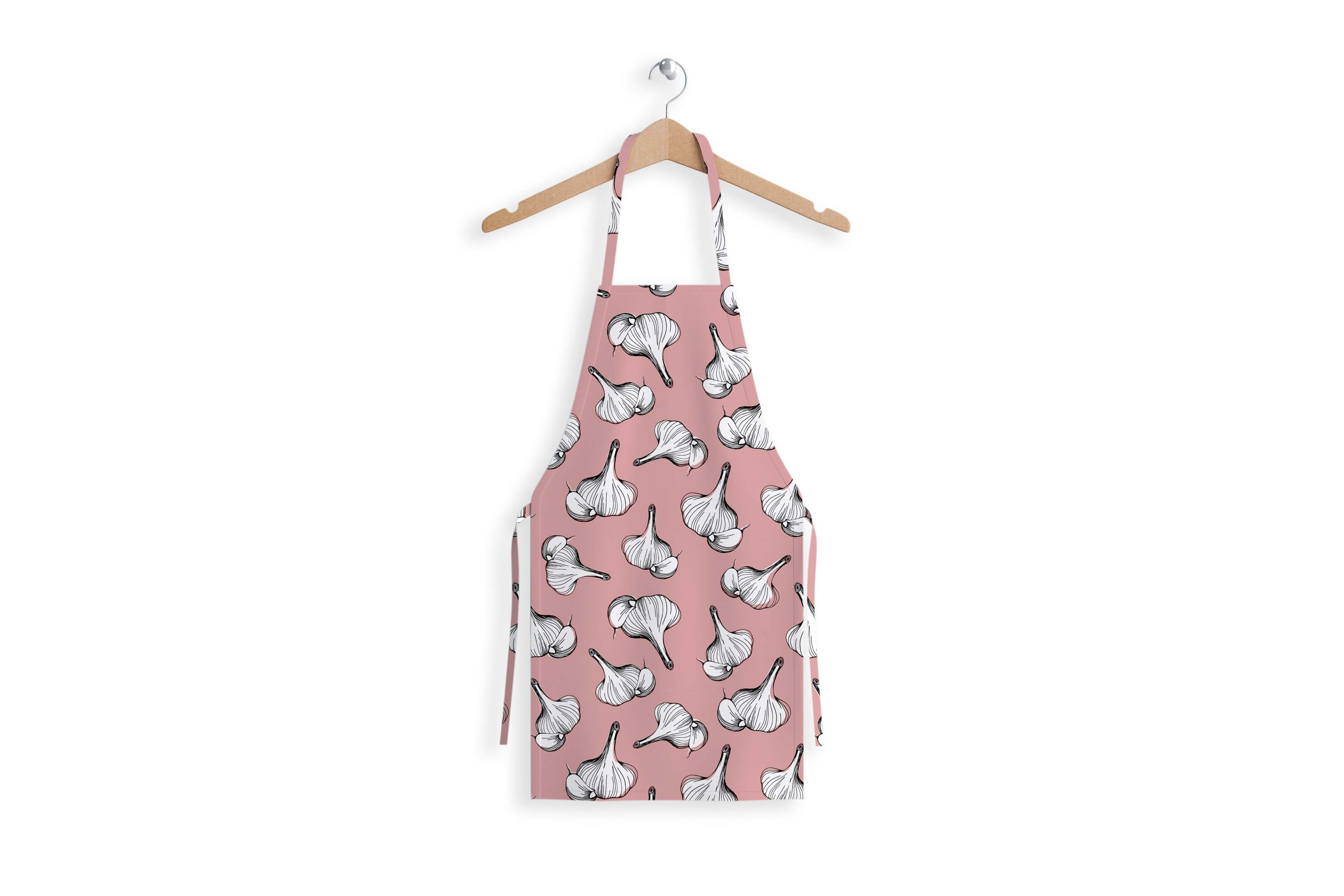 Apron with the image of garlic on a pink background.