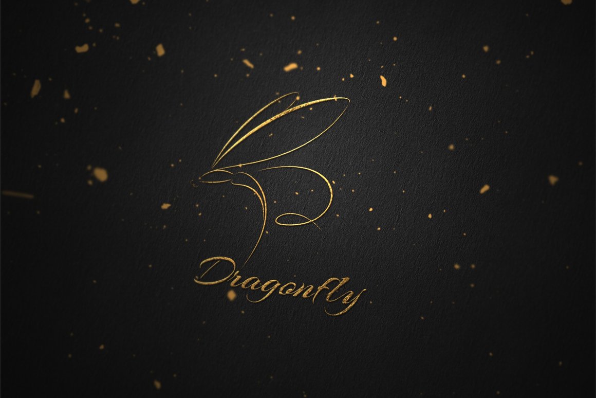 Golden dragonfly logo on a black background with gold particles.