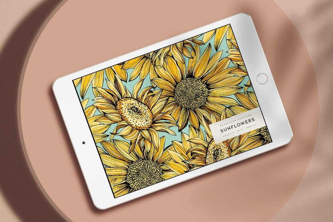 The tablet screen shows yellow sunflowers.