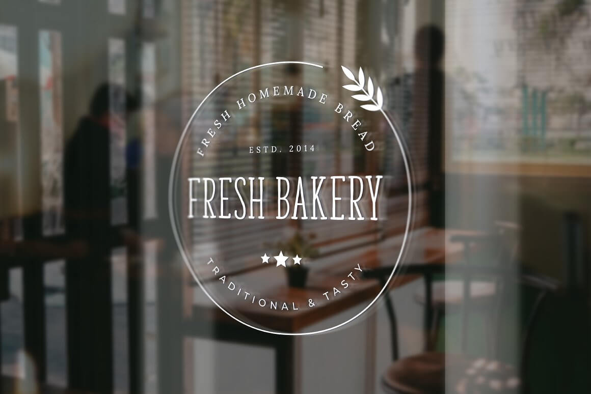 Large white bakery logo on glass: Fresh bakery.