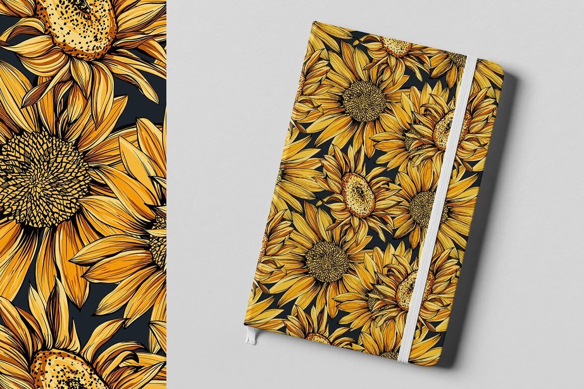 Yellow-orange sunflowers are depicted on a black notebook.
