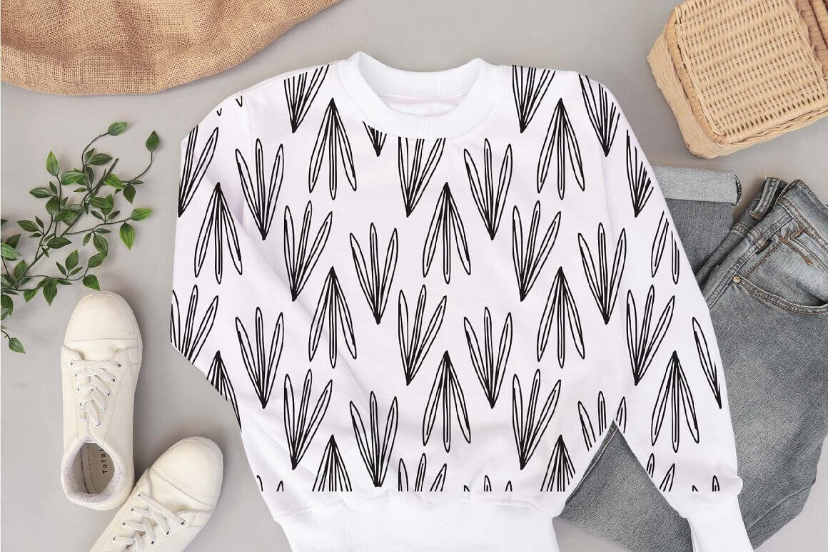 White sweater with black sushi food pattern design.