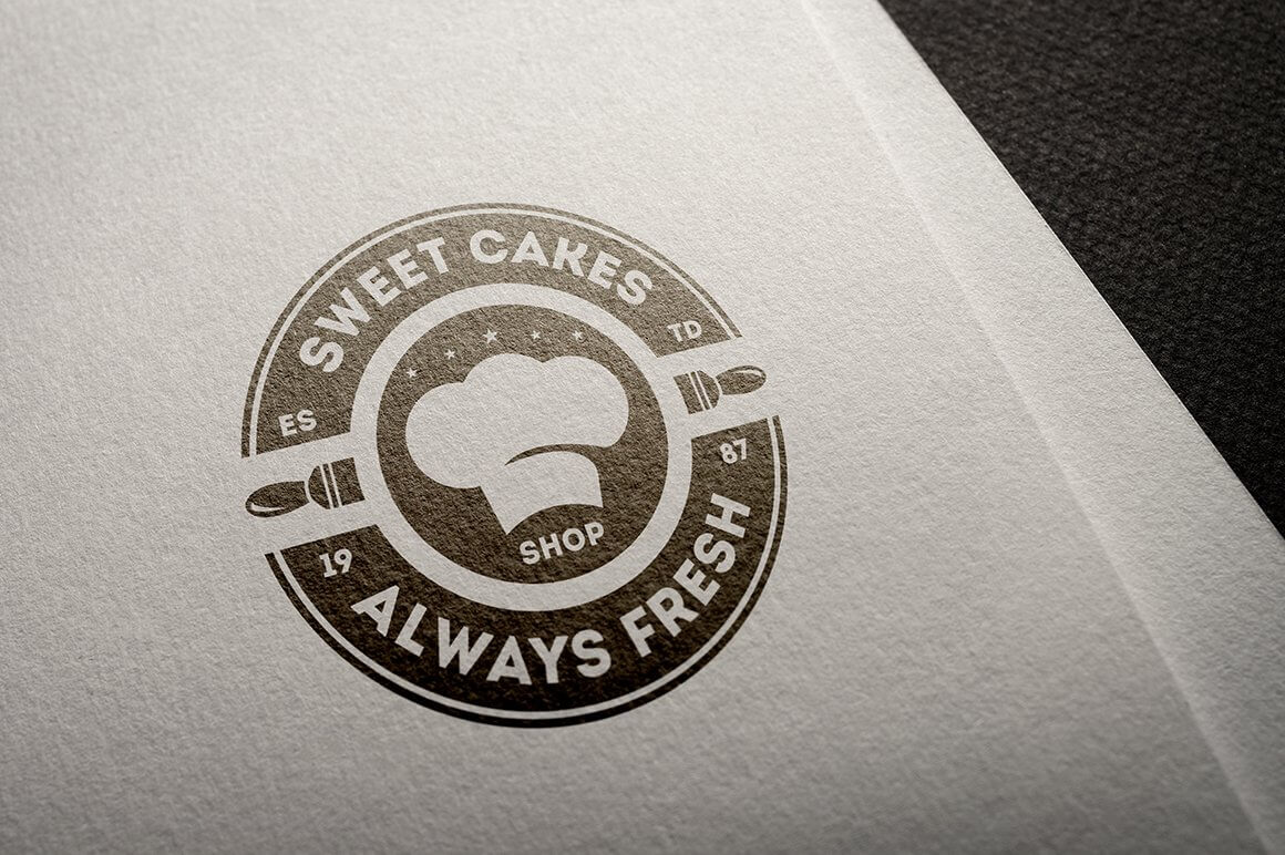 Brown "Sweet Cakes, Always Fresh" logo on white paper.