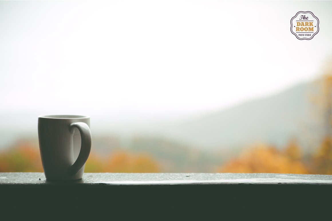Photo of a cup on the background of a mountain landscape.