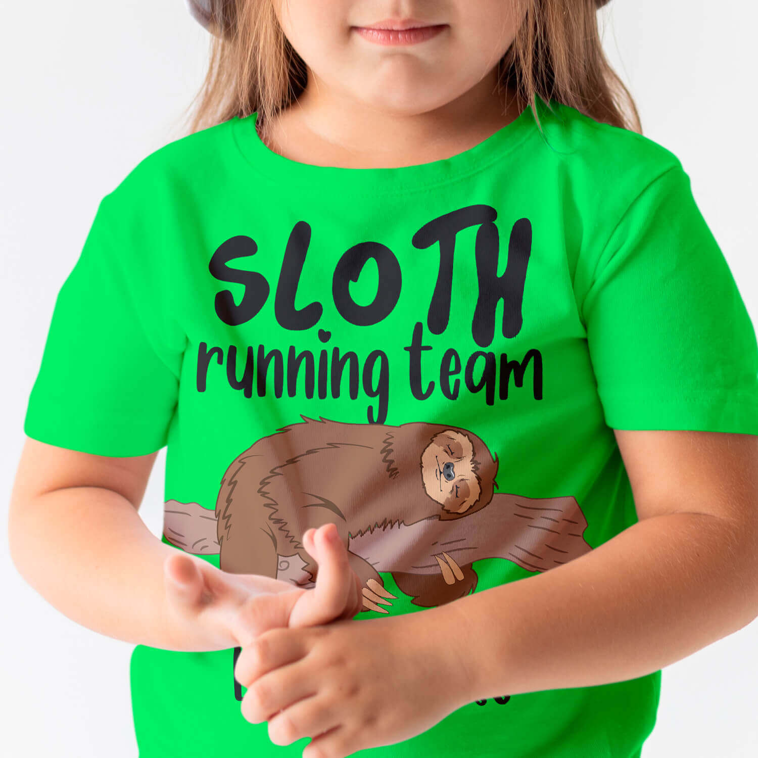 Little girl wearing a green shirt with a sloth running team on it.