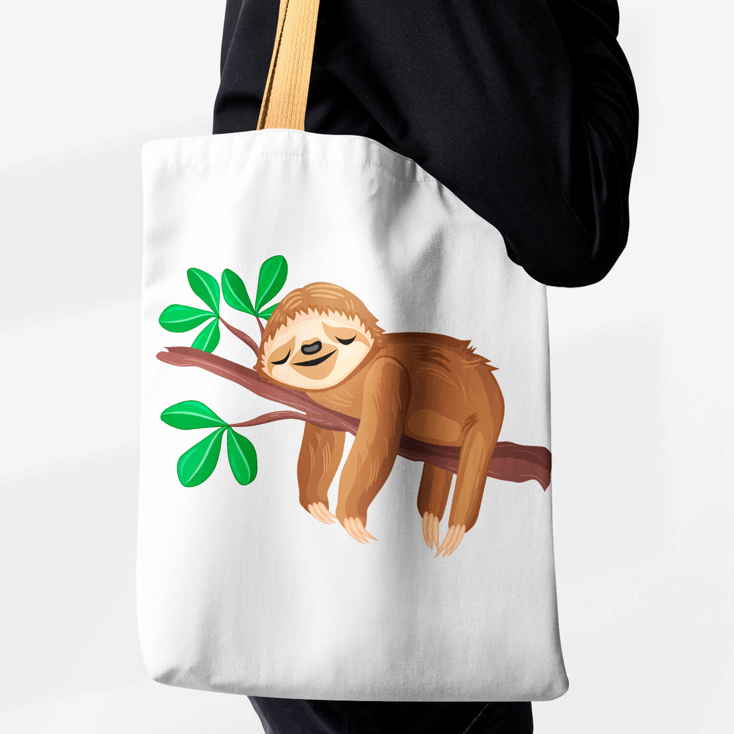 Woman carrying a tote bag with a slotty sleeping on a tree branch.