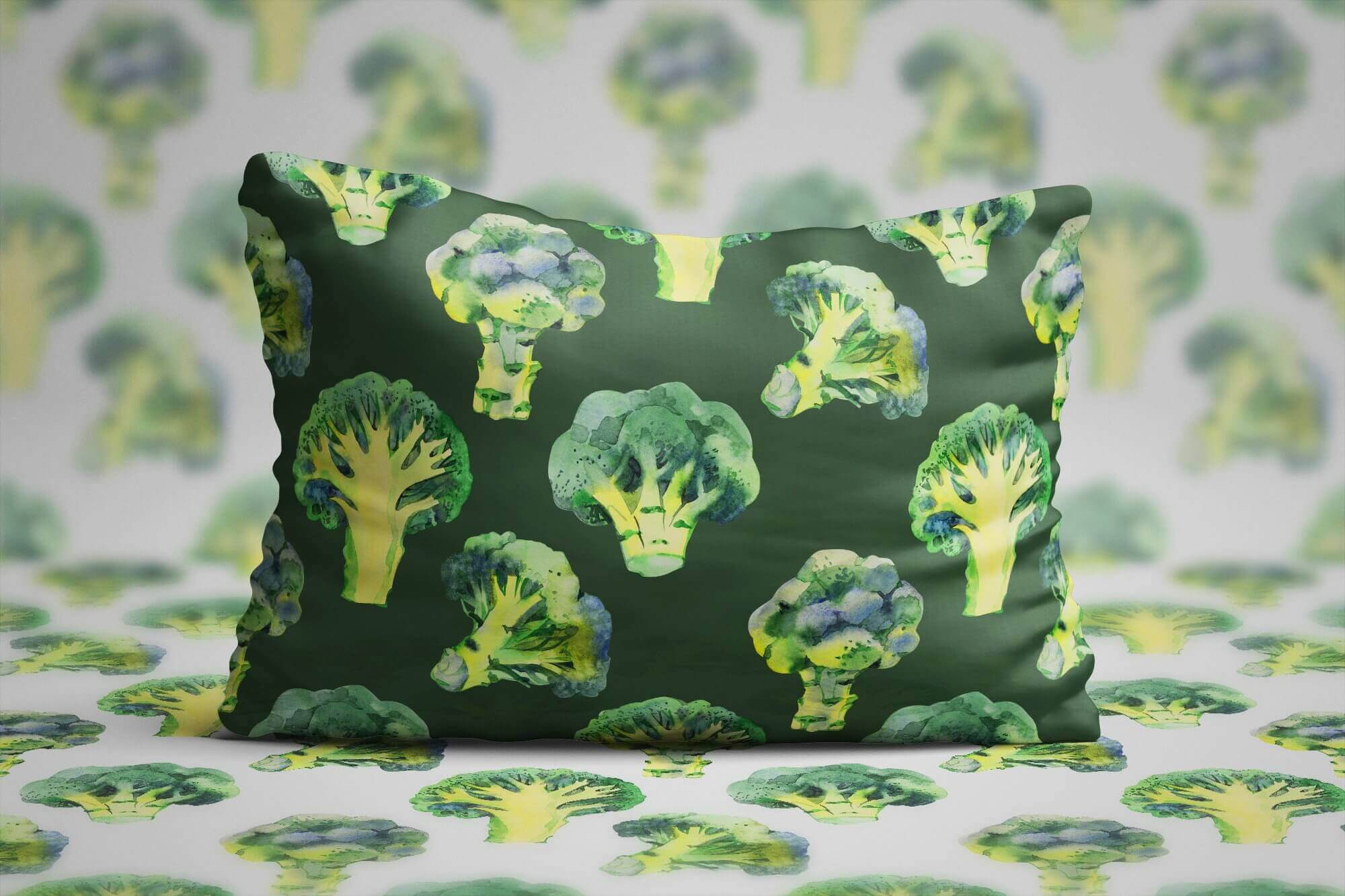 Dark green pillow with an watercolor image of broccoli.