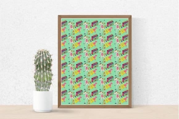 There is a cactus and a picture of unicorns on a white table.