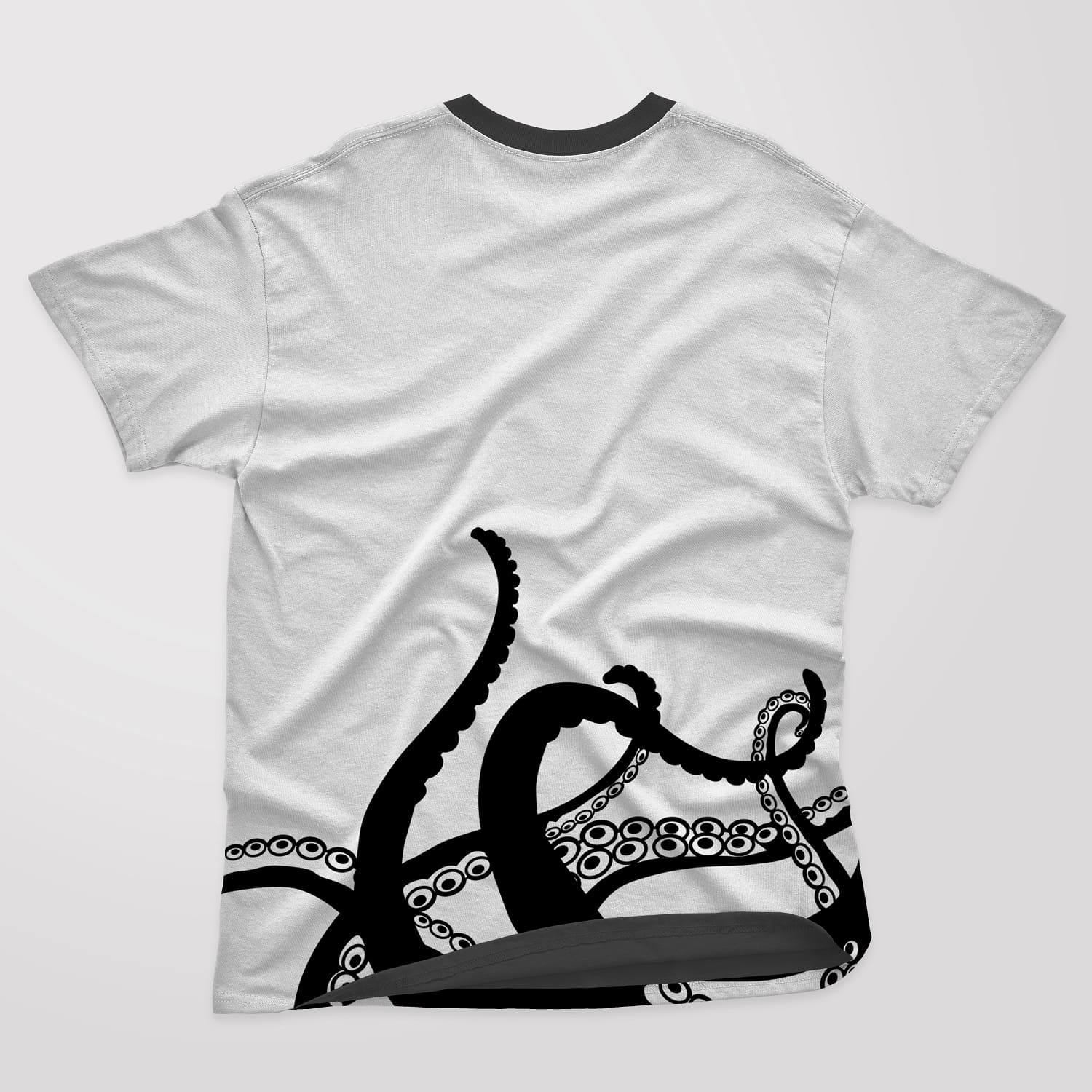 Black and white t-shirt with octopus tentacles on a white background.