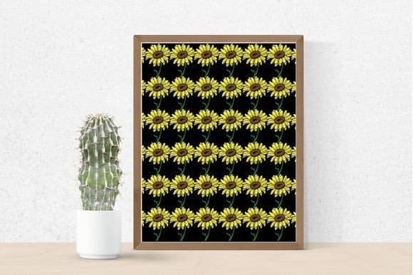 Painting with patterns of sunflowers on a black background next to a cactus.