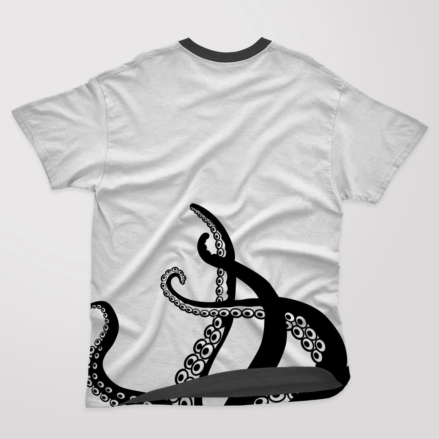 Black and white t-shirt with four octopus tentacles on a white background.
