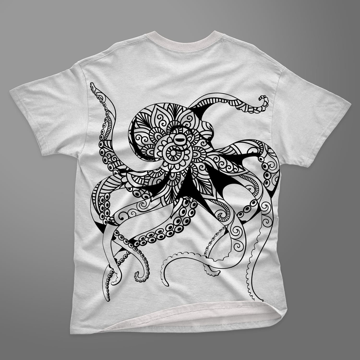 White t-shirt with the image of an octopus mandala close-up on a gray background.