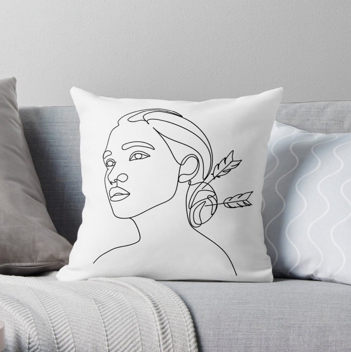 White decorative pillow with zodiac horoscope.