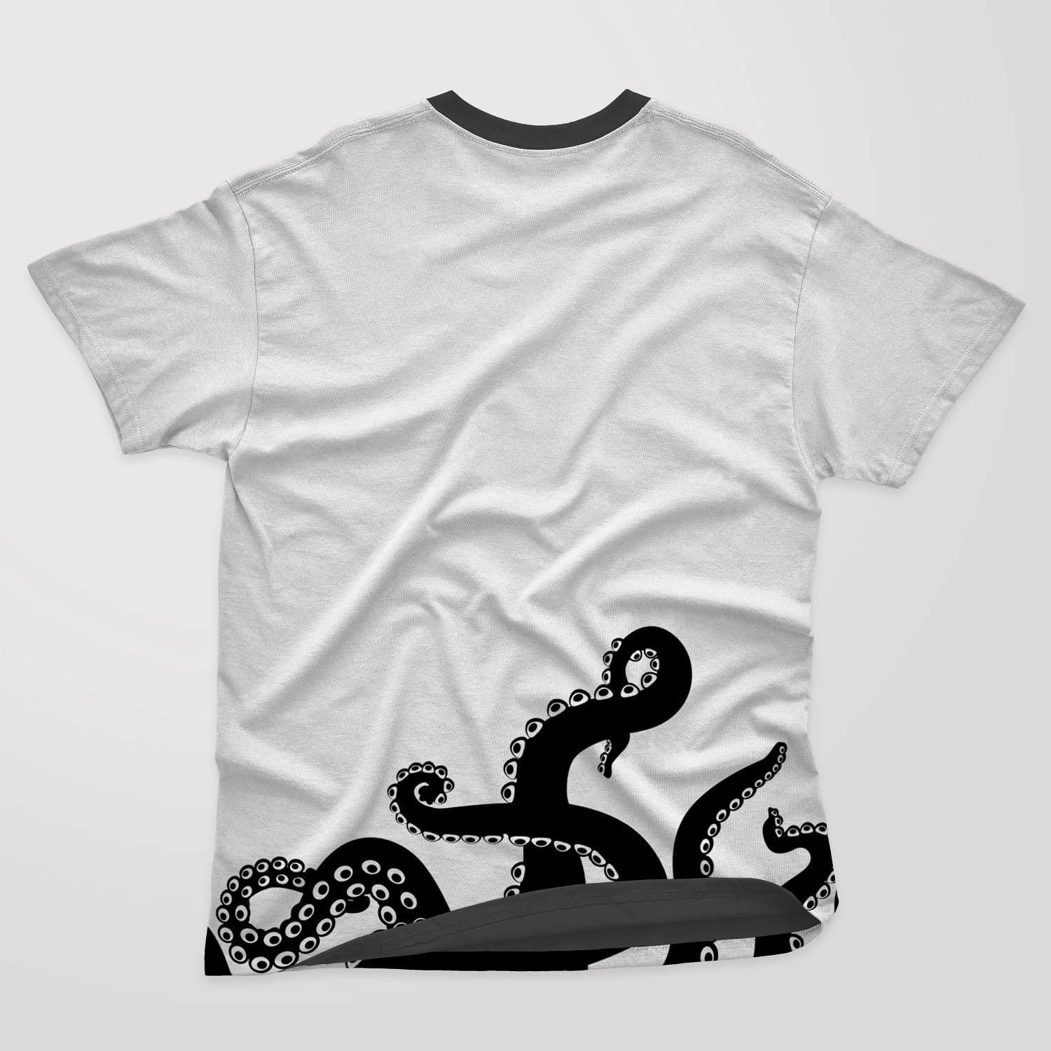 Five black octopus tentacles on a white t-shirt.