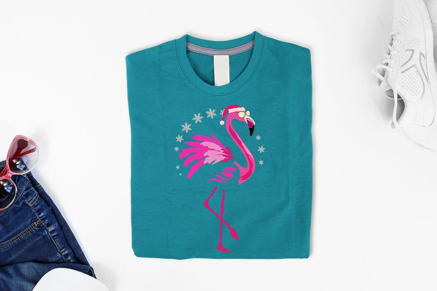 Christmas flamingo on teal tshirt mockup.